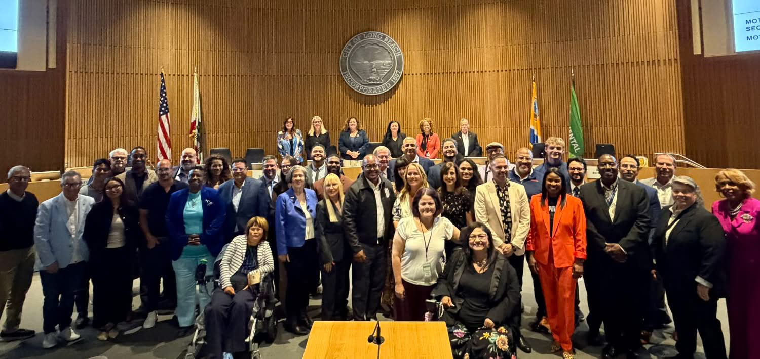 Shannon Holloway with municipal leaders in Long Beach City Hall.