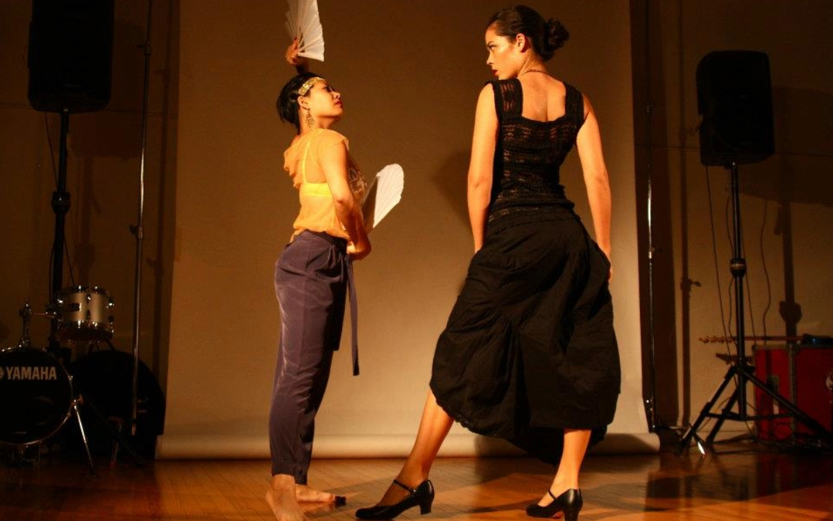 Shannon and woman facing each other in dance performance