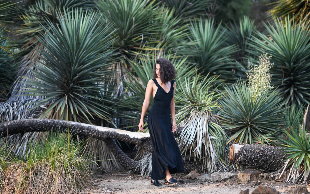 Shannon in black dress in cactus garden