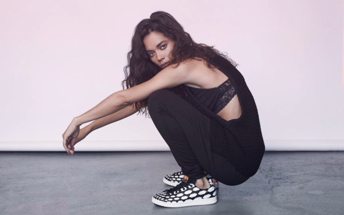 Shannon kneeling in streetwear